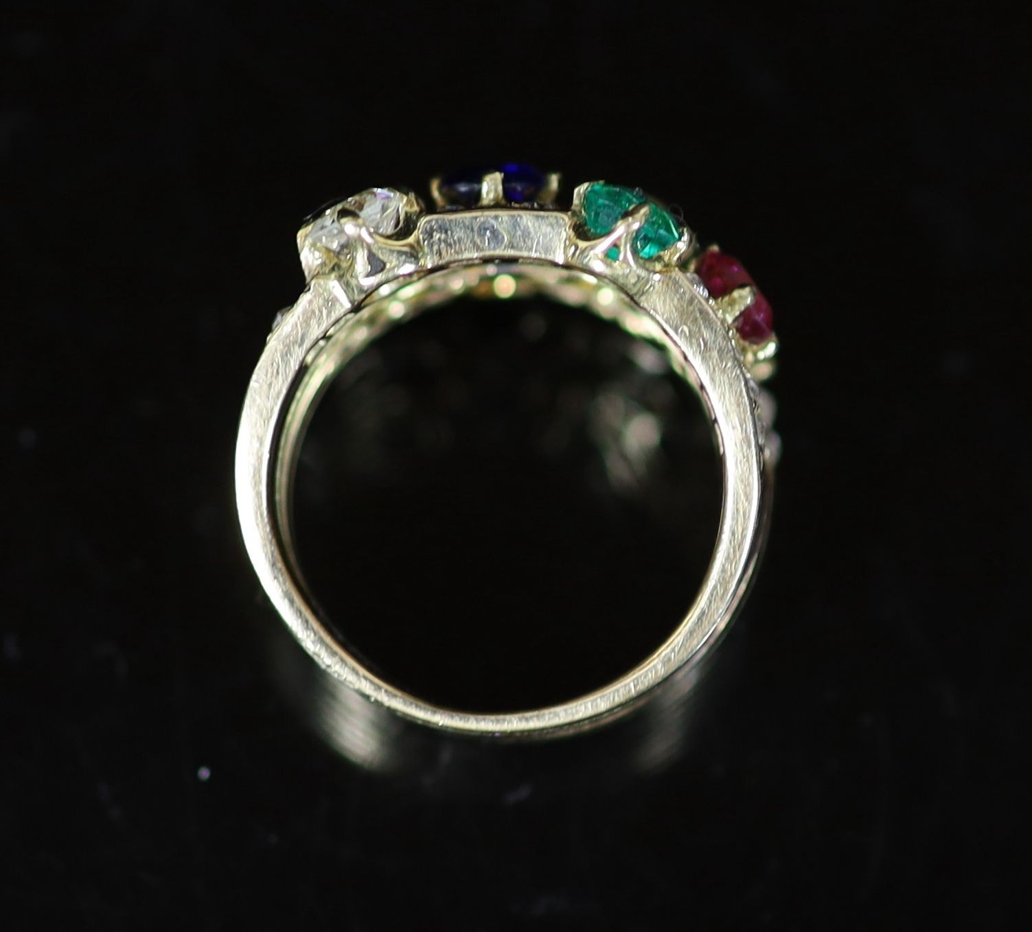 A gold, emerald, ruby, sapphire and diamond set quadruple shank dress ring